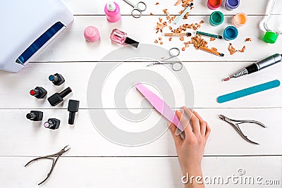 Manicure set and nail polish on wooden background Stock Photo