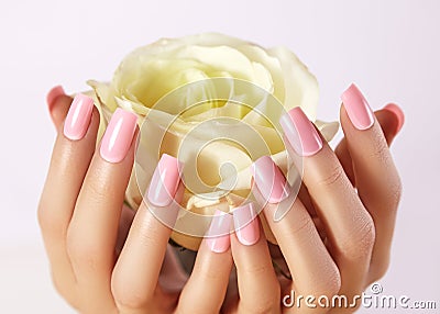Manicured nails with pink nail polish. Manicure with nailpolish. Fashion art manicure, gel lacquer. Acrylic nails salon Stock Photo