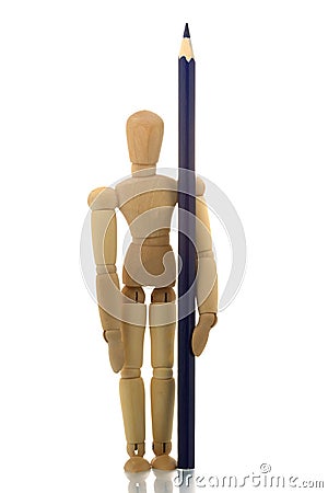 Manikin standing with pencil Stock Photo