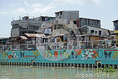 Manila, philippines, circa March 2023 - squatter homes at the pasig river Editorial Stock Photo