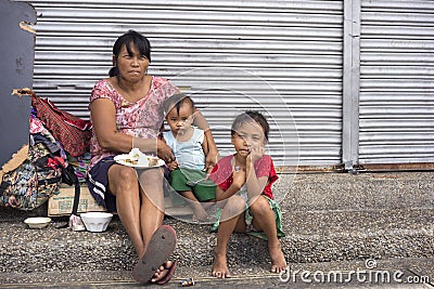 Homeless woman with her children Editorial Stock Photo