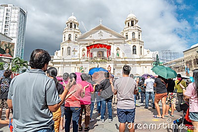 Filipino Catholic devotees attend outdoor prayers,to the Black Christ,at the Minor Basilica of the Black Nazarene Editorial Stock Photo