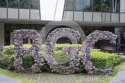 Beautiful sign of BGC or Bonifacio Global City seen in a garden Editorial Stock Photo