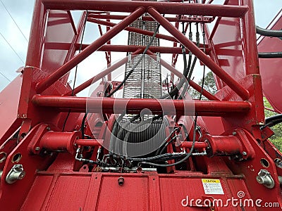 Manitowoc Red Crane Construction scene cloudy rainy day cable spool Editorial Stock Photo