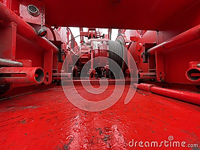 Manitowoc Red Crane Construction scene cloudy rainy day close up cable spool Editorial Stock Photo
