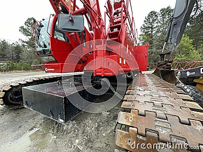 Manitowoc Red Crane Construction scene cloudy rainy day corner view Editorial Stock Photo