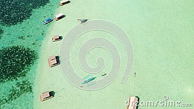 Manlawi Sandbar floating cottages in Caramoan Islands. A lagoon with floating crotches, top view. Stock Photo