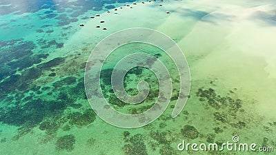 Manlawi Sandbar floating cottages in Caramoan Islands. A lagoon with floating crotches, top view. Stock Photo