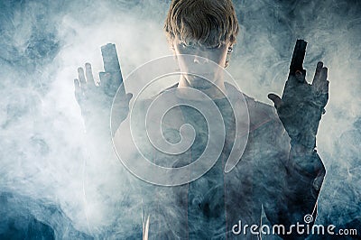 Manly hero with pistols in hands Stock Photo