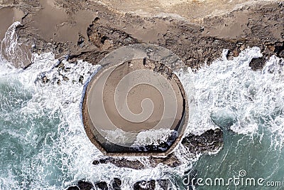 Manmade Pool at Rugged Beach Stock Photo