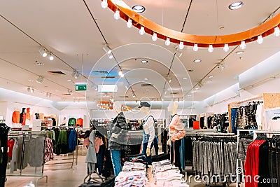 Mannequins Dressed In Female Woman Casual Clothes And Clothes On Shelves And Hanger In Store Editorial Stock Photo