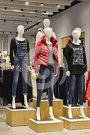 Mannequins in fashion shop, jeans and down jacket fashion Mannequins Editorial Stock Photo