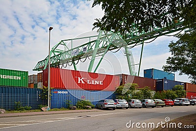 Big industrial container terminal and crates at inland port at Neckar river called `Salzkai` in Man Editorial Stock Photo