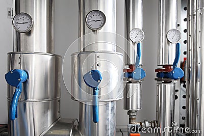 Manometer, pipes and faucet valves of heating system in a boiler Stock Photo