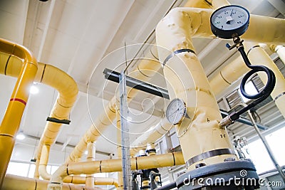 Manometer, pipes and faucet valves of heating system Stock Photo