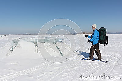 Manon ski looking at the ice breaking on the river Stock Photo