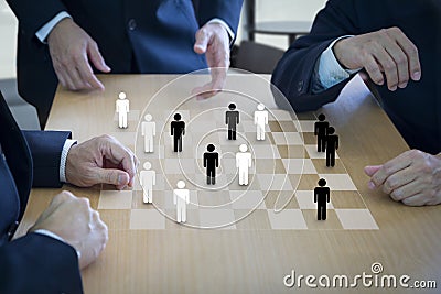 Manpower planning on a draughtboard Stock Photo