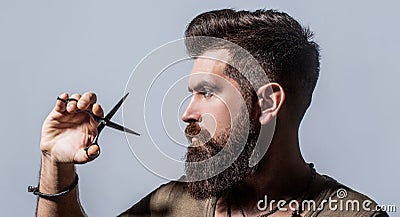 Mans haircut in barber shop. Barber scissors, barber shop. Barber scissors. Vintage barbershop, shaving. Male in Stock Photo