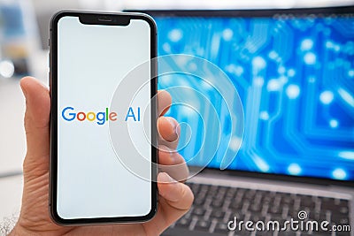 A mans hand holding a smartphone with Google AI neural network logo on the screen. Editorial Stock Photo