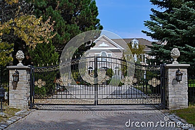 Mansion with gilded gate Stock Photo