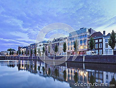 Mansions mirrored in a harbor at twilight, Breda, Netherlands Stock Photo