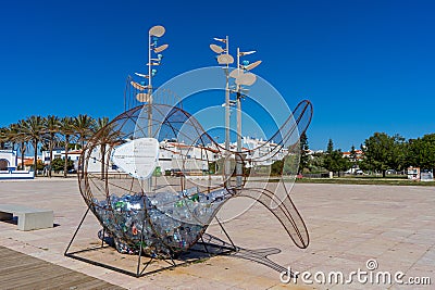 Plastic garbage collector on Manta Rota beach. Editorial Stock Photo