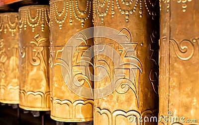 Mantra om mane padme hum on prayer drums Stock Photo