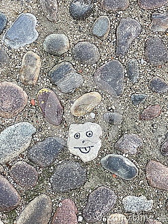 Stone used as a background for drawing a human face Stock Photo