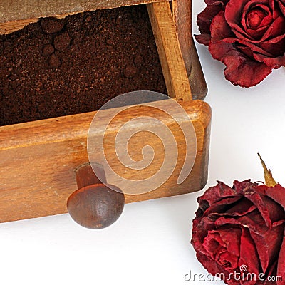 Manual coffee grinder on a white background. Antiquary Stock Photo