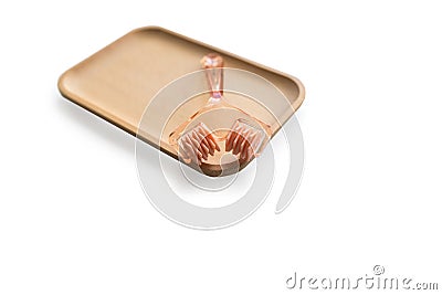 manual face massager, beauty machine. Cosmetology without injections. Anti-wrinkle device on a wooden tray, isolated Stock Photo