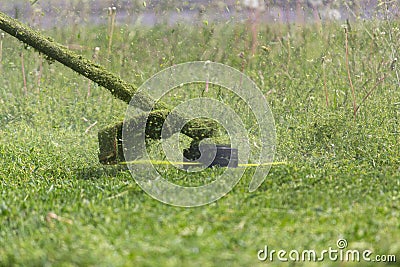 Manual lawn mower while mowing lawn Stock Photo