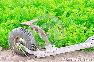 A manual plow on an electric winch. Cultivator. Agricultural tools, farming. Agriculture. Plowing the ground before planting, Stock Photo