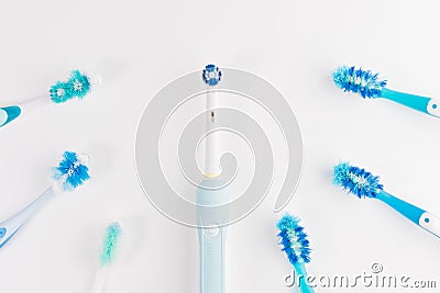 Manual regular Toothbrush Against Modern Electric Toothbrush. Isolated on White Background Stock Photo