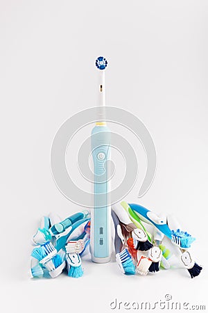 Manual regular Toothbrush Against Modern Electric Toothbrush. Isolated on White Background. Stock Photo