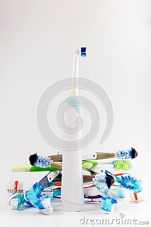 Manual regular Toothbrush Against Modern Electric Toothbrush Stock Photo