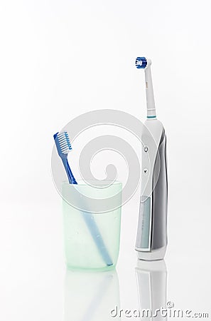 Manual Regular Toothbrush vs Electric Toothbrush Stock Photo