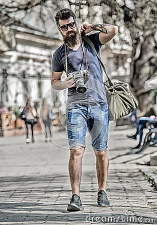 Manual settings. Photographer with beard and mustache. Tourist shooting photos. Content creator. Man bearded hipster Stock Photo