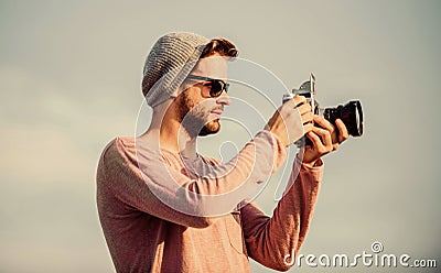 Manual settings. Photojournalist concept. Travel blogger. Professional photographer. Handsome photographer guy retro Stock Photo