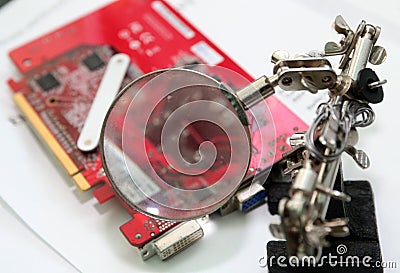 Manual worker human hand holding soldering iron tool repairing computer electronics circuit board Stock Photo