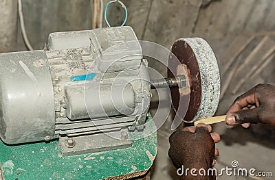 Manually improvisation of metal turnery for wood carving in Kenya Stock Photo