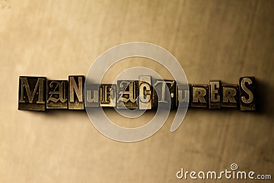 MANUFACTURERS - close-up of grungy vintage typeset word on metal backdrop Cartoon Illustration