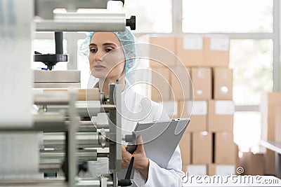 Manufacturing supervisor looking worried during quality control Stock Photo
