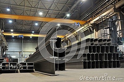 Manufacturing of a welded I-beam on an automatic welding line. Products of the plant for the production of metal structures Stock Photo