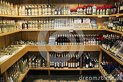 Many alcohol whiskey and wine for sale travelers people Editorial Stock Photo