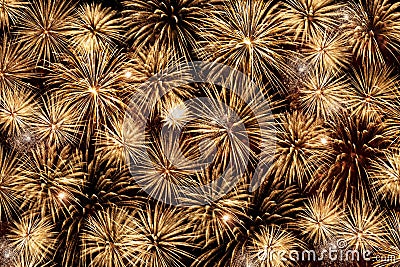 Many beautiful Golden fireworks exploding in the night sky Stock Photo