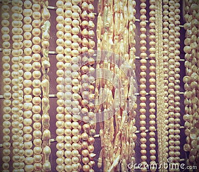 Many beautiful shimmering pearl necklaces for sale Stock Photo