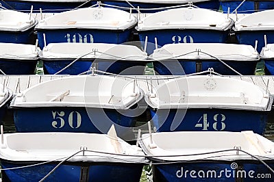 Many blue and white dingy boats background Stock Photo