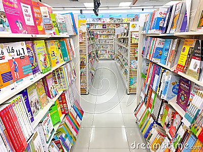 Many books on shelves in Thai book store Bangkok, Thailand April Editorial Stock Photo
