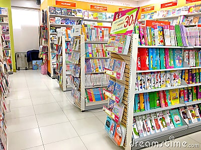 Many books on shelves in Thai book store Bangkok, Thailand April Editorial Stock Photo