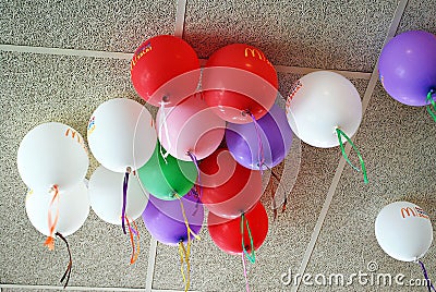 Many bright balloons under ceiling close-up Editorial Stock Photo